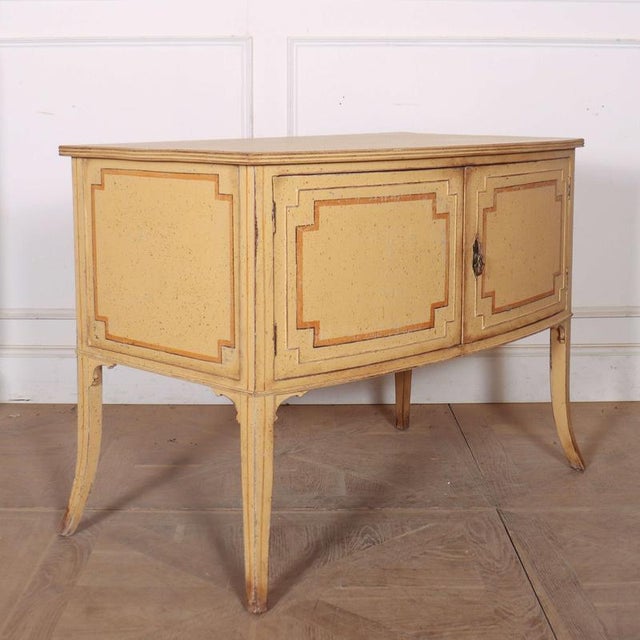 19th C English pine side cabinet on a saber leg. 1890 This piece is designed in the style of the selected designer and/or...