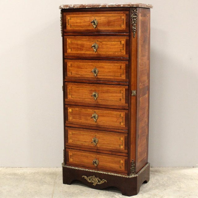 Napoleon III marquetry chest of drawers, with a marble top and splendid original gilded bronzes. Second half of the 19th...