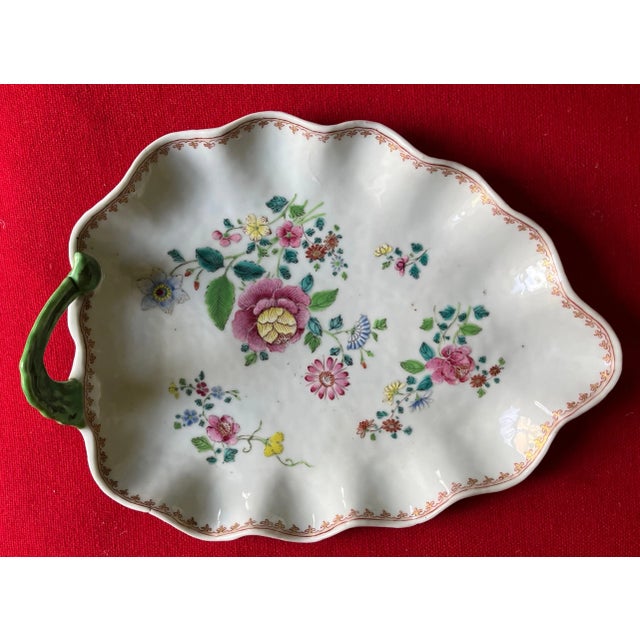 Antique 18th century Chinese export porcelain tobacco leaf platter in famille rose palette. Decorated with floral sprigs...