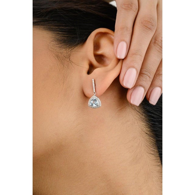 Sparkling Aquamarine Diamond Wedding Dangle Earrings for Her in 18K Gold to make a statement with your look. You shall...