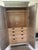A striking Regency-style armoire by Nancy Corzine, finished in a luminous tea leaf silver that gives the piece a soft,...