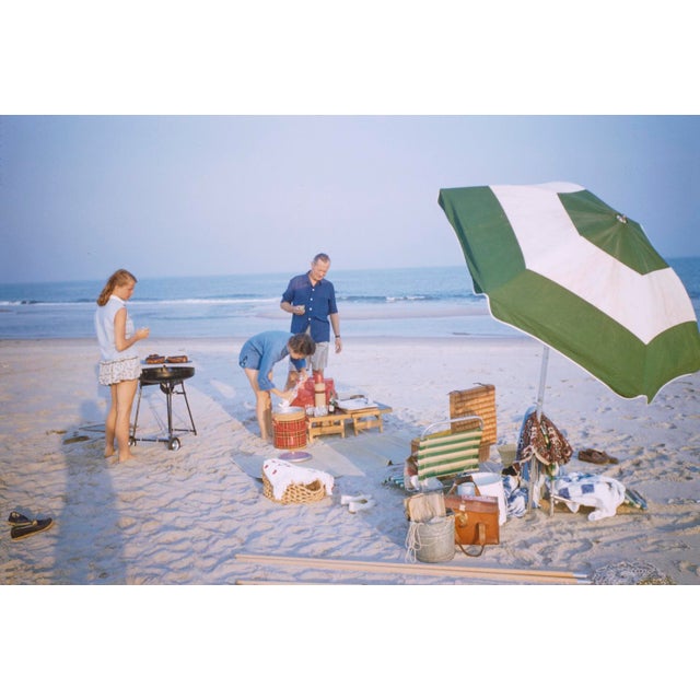 The Hamptons Picnic by Toni Frissell A family enjoy a picnic on The Hampton's beach, Long Island 1955. (Toni Frissell)...