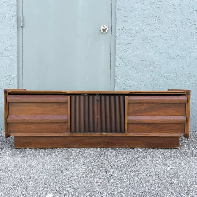 Vintage mid-century modern cedar storage chest by Lane, featuring a handsome walnut-toned exterior with clean...
