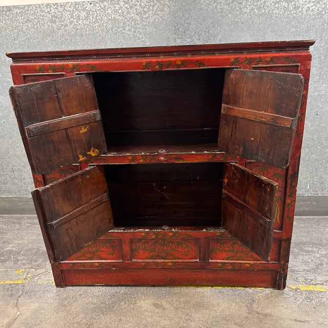 Design Plus Gallery presents an Antique Chinoiserie Red Lacquer Storage Cabinet. This distinctive wood cabinet showcases a...