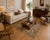 This handwoven decorative rug features a rich repertoire of traditional Caucasian-inspired motifs, including stylized...