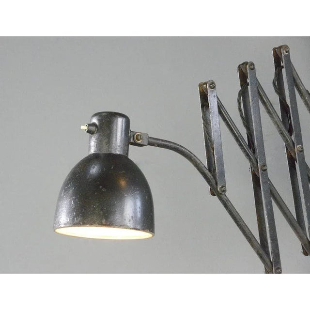 Hala Scissor Lamp Circa 1930s Original black paint - Steel shade and scissor mechanism - Bakelite On/Off switch on the...