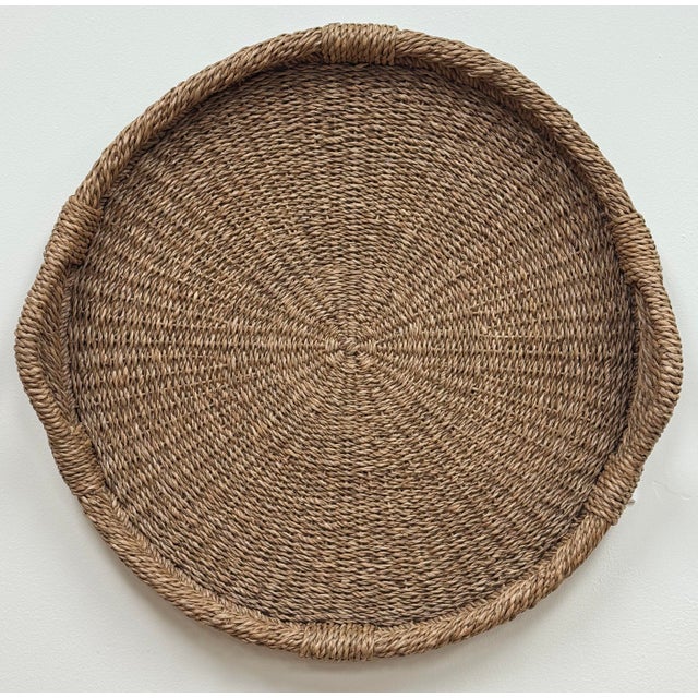 Wonderfully oversized vintage woven wicker basket tray with handles to each side. Great for a large ottoman or center of a...