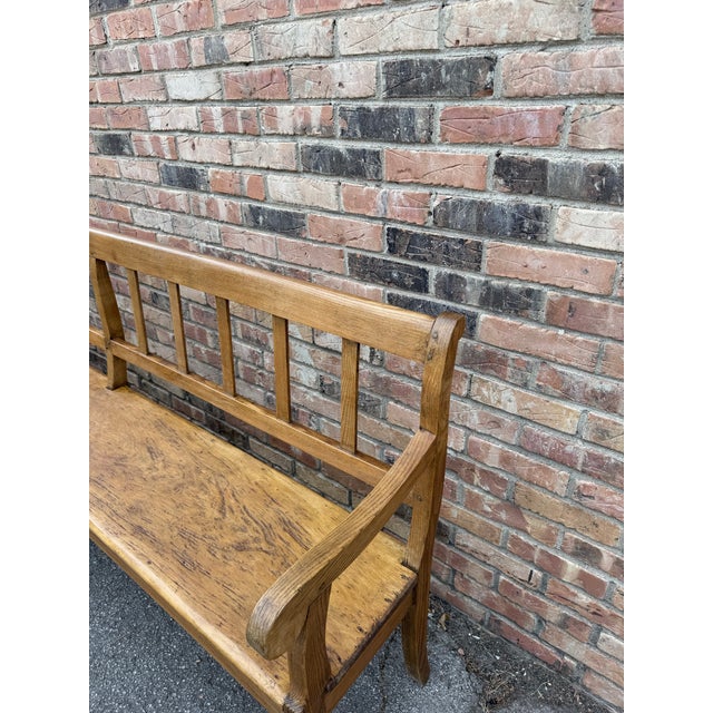 This is a 19th Century Oak English Elmwood Bench. It is a long substantial hall bench perfect for an entryway or living...