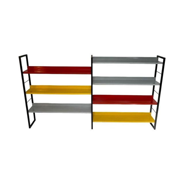 Free standing metal storage rack or bookcase. brightly colored and a prime example of post war Dutch design. Can easily be...