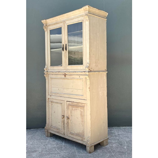 This commanding antique French Provincial secretary cabinet is a masterclass in Neoclassical elegance and artisanal...