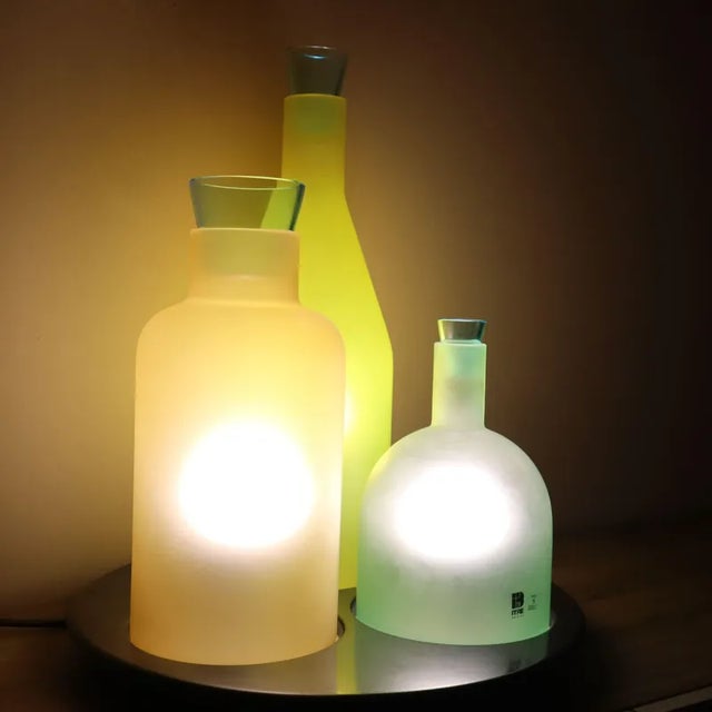 The Bacco 1-2-3 lamp: a masterpiece of Murano glass design The Bacco 1-2-3 table lamp, designed by Guido Rasati for Itre,...