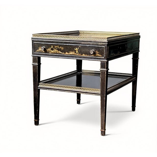 A striking, highly decorative pair of mid-20th-century Hollywood Regency-style tray-top side tables, seamlessly blending...