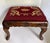 This charming antique English footstool features a beautifully carved wooden frame supported by graceful cabriole legs and...