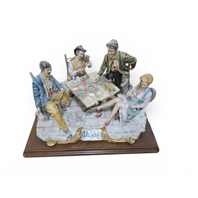 An impressive Italian Capodimonte polychrome porcelain figural group entitled “Partita a Carte” (The Card Game), depicting...