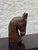 Large hand-carved wood horse head sculpture with detailed carved mane and expressive features. The elongated form and warm...