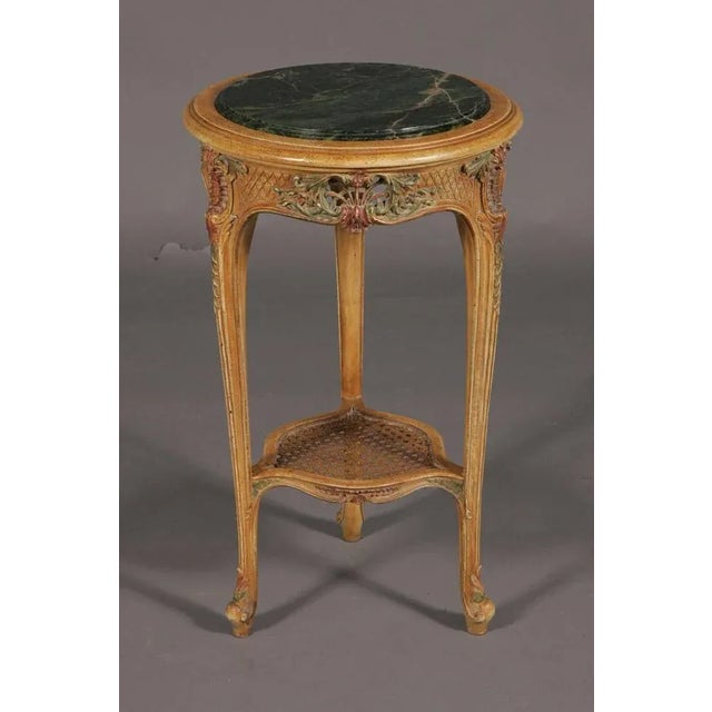 Excellent French occasional table in Louis XV style. Highly valuable solid beechwood carved to the finest detail. Colored...