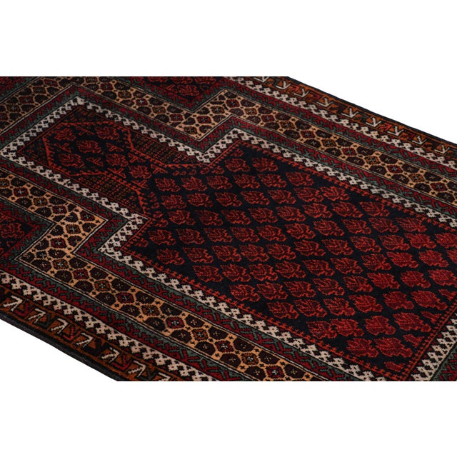 Hand knotted in wool, this 2x4 modern geometric rug represents a new line of tribal carpets in the Modern Classics...