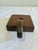 A charming vintage wooden chamberstick-style candle holder featuring a distinctive sculptural handle and simple...