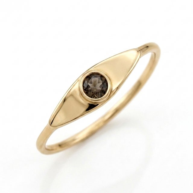 Add a touch of subtle drama to your collection with this geometric eye ring. A rich, 3mm Smoky Quartz gemstone sits flush...