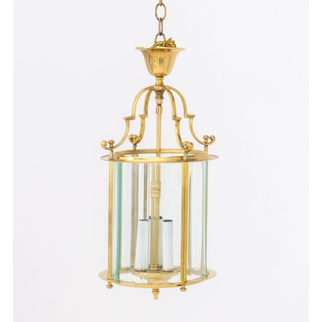 Modern Brass and Glass Lantern Pendant Lamp, cylindrical with center brass column with three candlestick style lights. 19"...