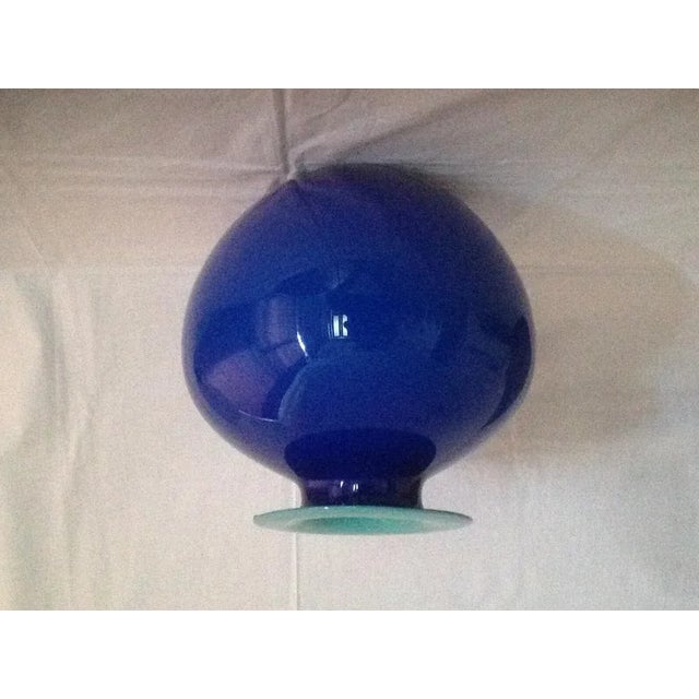 Beautiful Incamiciato glass vase. Blue color, light green interior. Made in Murano, Italy, circa 1968. This piece has an...