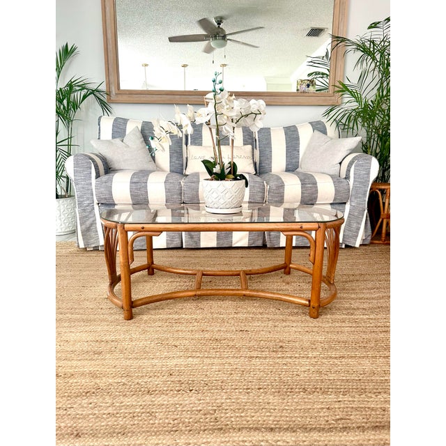Beautiful glass fop rattan coffee table. Excellent condition! Unique shape!