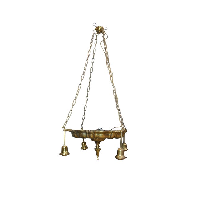 Antique Victorian drop light pendant chandelier. Made of brass featuring Hollywood Regency styling with four lights....