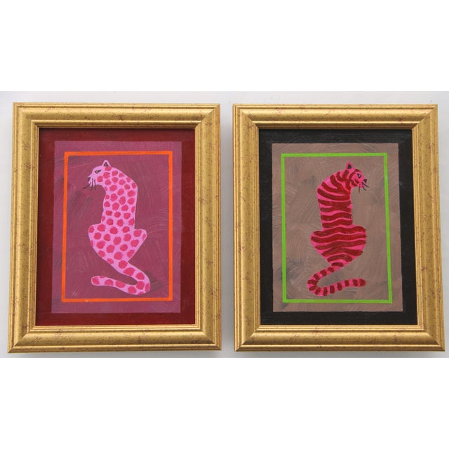 Pair: A spotted leopard and striped tiger in shades of mauve, raw umber, green pink with a burgundy or sepia border....