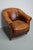 This cognac-colored leather club chair comes from the Netherlands. It is upholstered with cognac-colored leather and...
