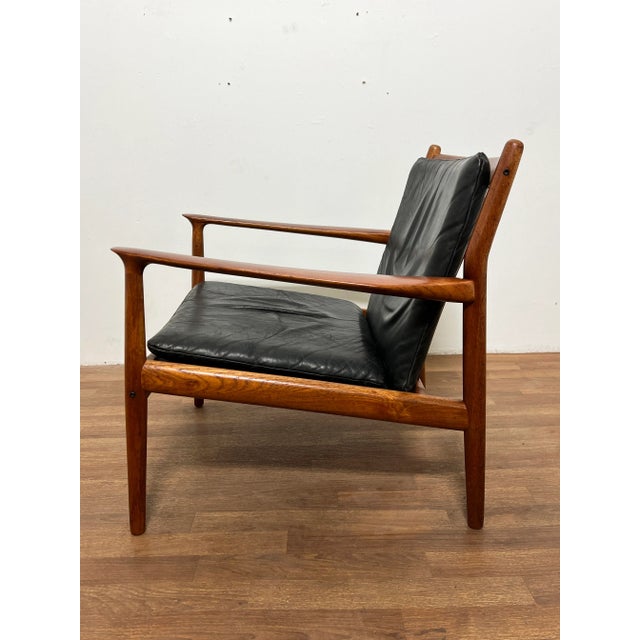 A Danish teak lounge chair in original soft leather upholstery, designed by Svend Aage Eriksen for Glostrup Mobelfabrik,...