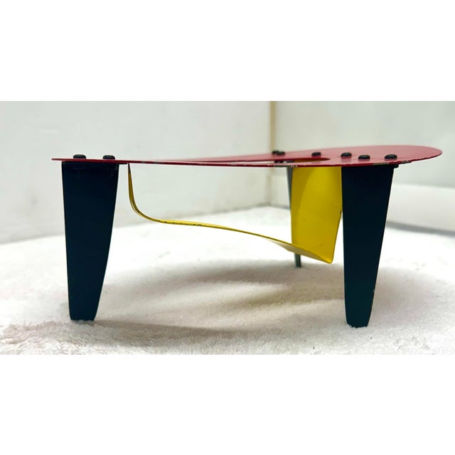 Description Brad Howe (1959, America)Metal Sculpture in the style of Calder. Three black coated metal legs supporting a...