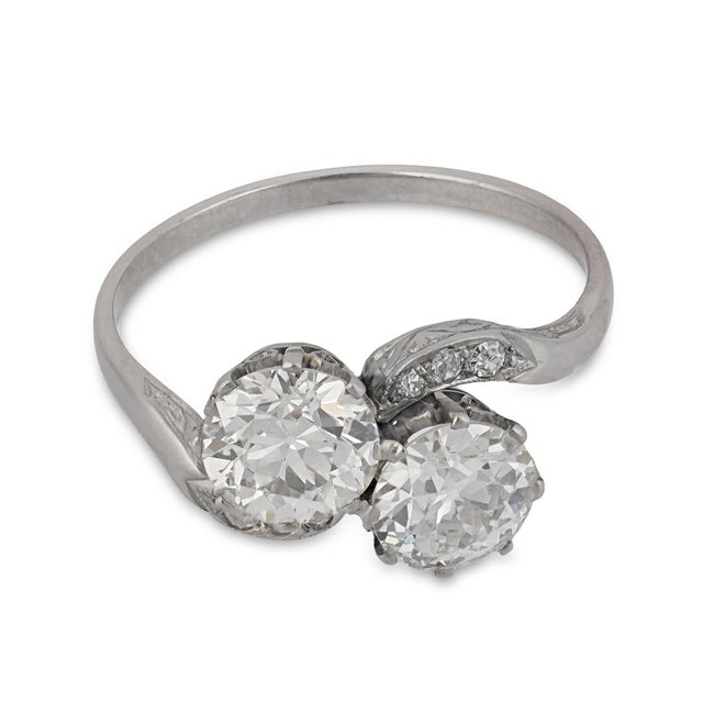 This Art Deco Toi et Moi ring is a beautiful embodiment of romance and refined 1930s design. At its center, two old...