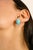 These Turquoise Cabochon and CZ Trio Stud Earrings striking stud earrings feature vibrant oval turquoise cabochons,...
