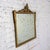 Magnificent vintage Baroque or Rococo style rectangular wall mirror composed of a gilded wood frame with hand carved and...
