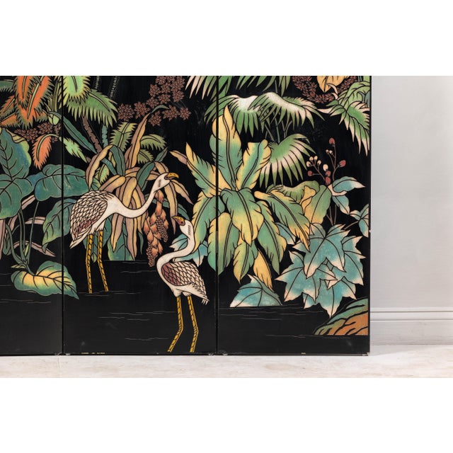 A black lacquer four-panel screen divider with vivid bird and flora décor. This four-panel screen is a captivating piece...