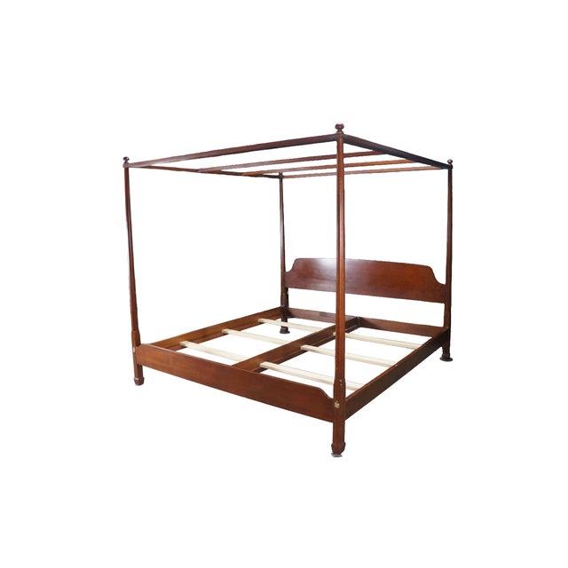 Harden Furniture King-size four-poster canopy bed, a striking example of traditional American craftsmanship, beautifully...