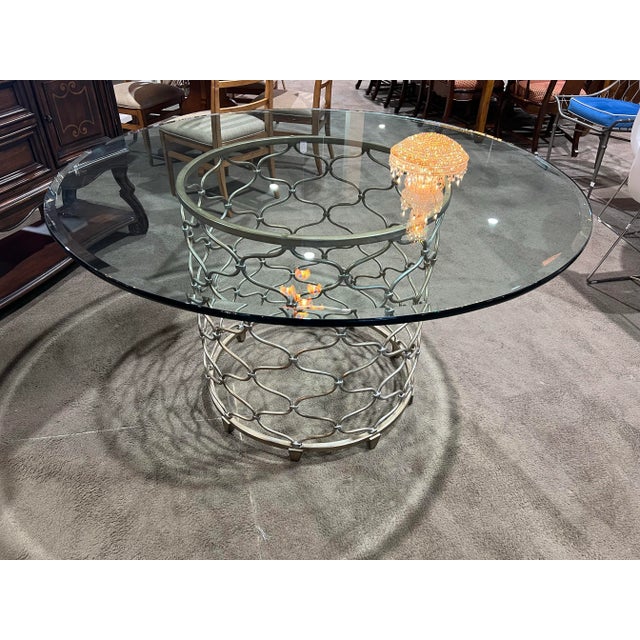 Sleek and sophisticated, this Lexington Silver Base Glass Top Dining Table brings modern elegance to any dining space. The...