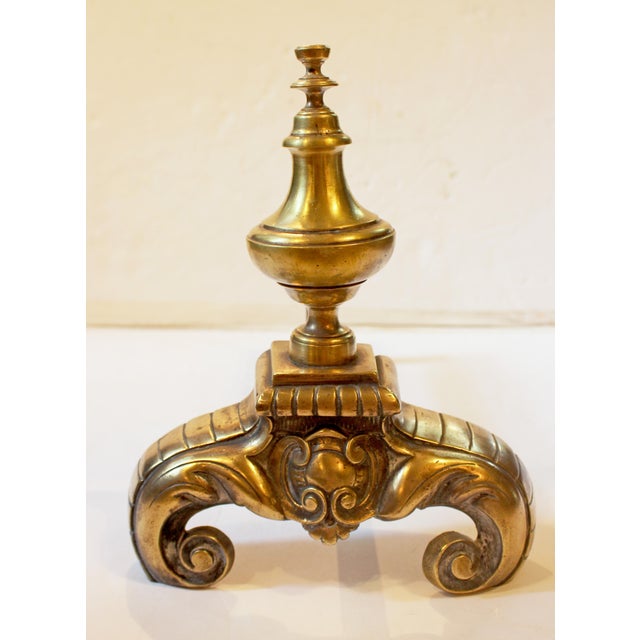 Circa 1860-80 pair of French Baroque Revival Andirons. Cast brass or bronze with iron logs rest. Raised on scrolled legs...