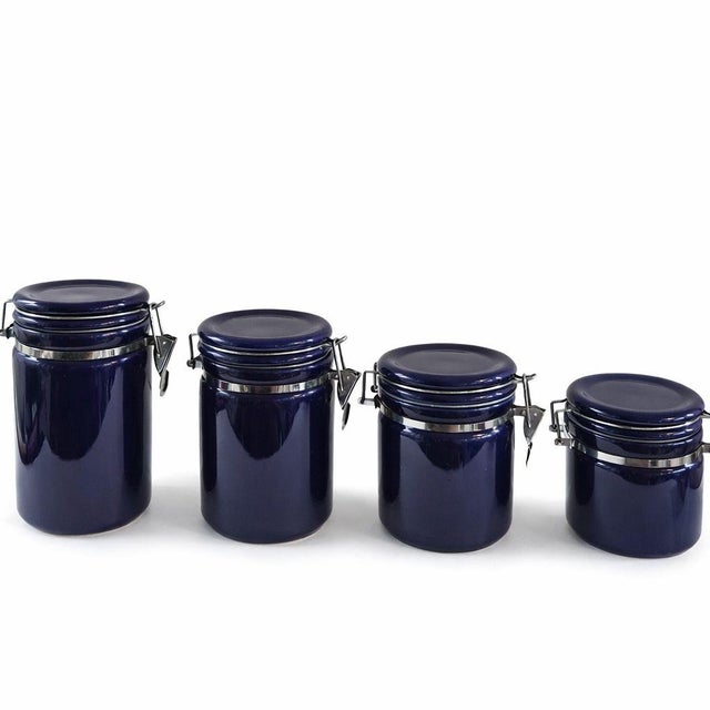 Set of 4 Cobalt Blue Canisters with Wooden Spoons The vintage Gibson rounded cobalt blue canisters with original wooden...