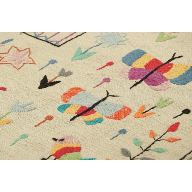 Made with handwoven wool, this 2x7 Kilim runner rug represents an exciting new line of Modern Classics and contemporary...