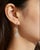 Elegant 14K white gold dangle earrings featuring a floral-inspired design with 12 brilliant round diamonds totaling 0.5...