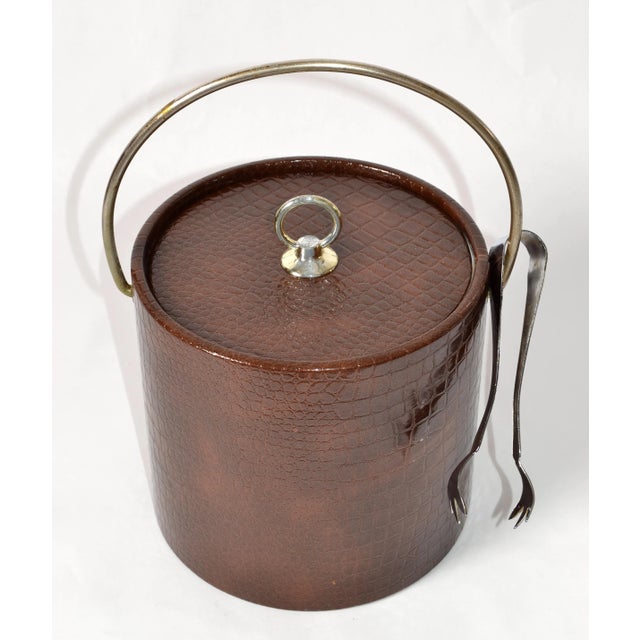 1960s Retro Brown Embossed Faux Alligator or Crocodile Leather Ice Bucket with Steel Tongs. Inside is insulated with a...