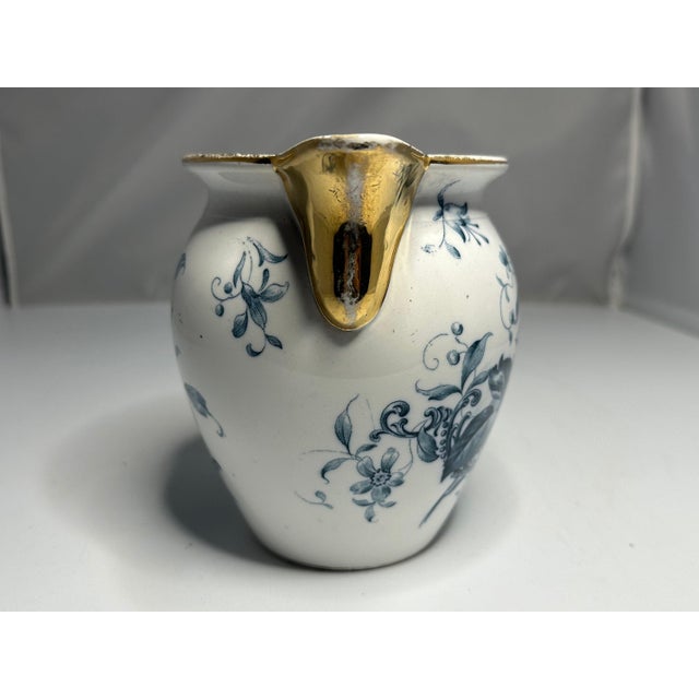 Antique Floral Blue Transferware Porcelain Pitcher for your consideration. The pitcher measures approx. 5 3/8 inches tall...