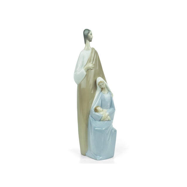 This exquisite Lladro "Holy Family" figurine, sculpted by the legendary Fulgencio García and first issued in 1969, is a...