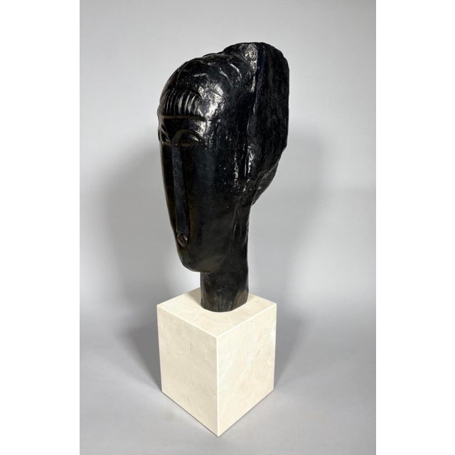 Amedeo Modigliani (1884-1920). Head of a Young Girl with Bangs Bronze with brown patina, signed, lost-wax casting Numbered...