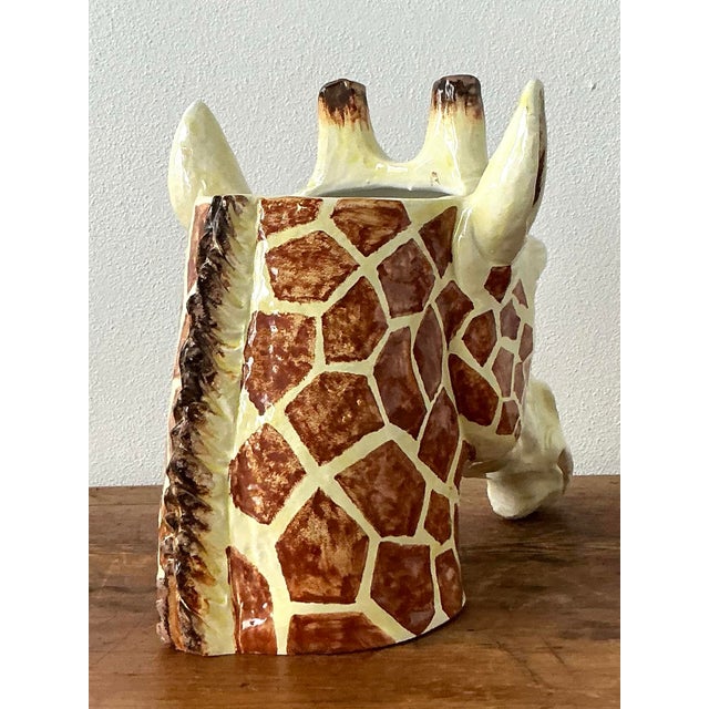 This enchanting vintage giraffe cachepot is a masterful celebration of Italian ceramic artistry, perfectly capturing the...