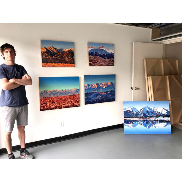 This oil painting captures the dramatic landscape of the Sangre De Cristo mountains at sunrise, with bold brushstrokes...