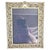 A fine late Victorian photograph frame featuring an extensively decorated sterling silver mount, hallmarked Birmingham...