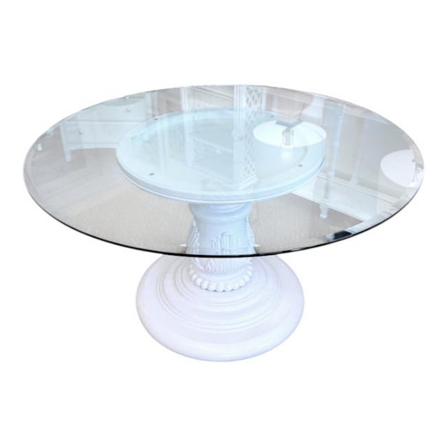 Elegant vintage pedestal table featuring a beautifully carved wood base with scrolling acanthus details, turned column,...