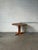Beautiful vintage Danish mid-century modern dining table crafted in warm teak wood, featuring an elegant round tabletop...